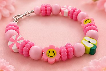 Kralenarmbandje in roze met smiley en bloem
